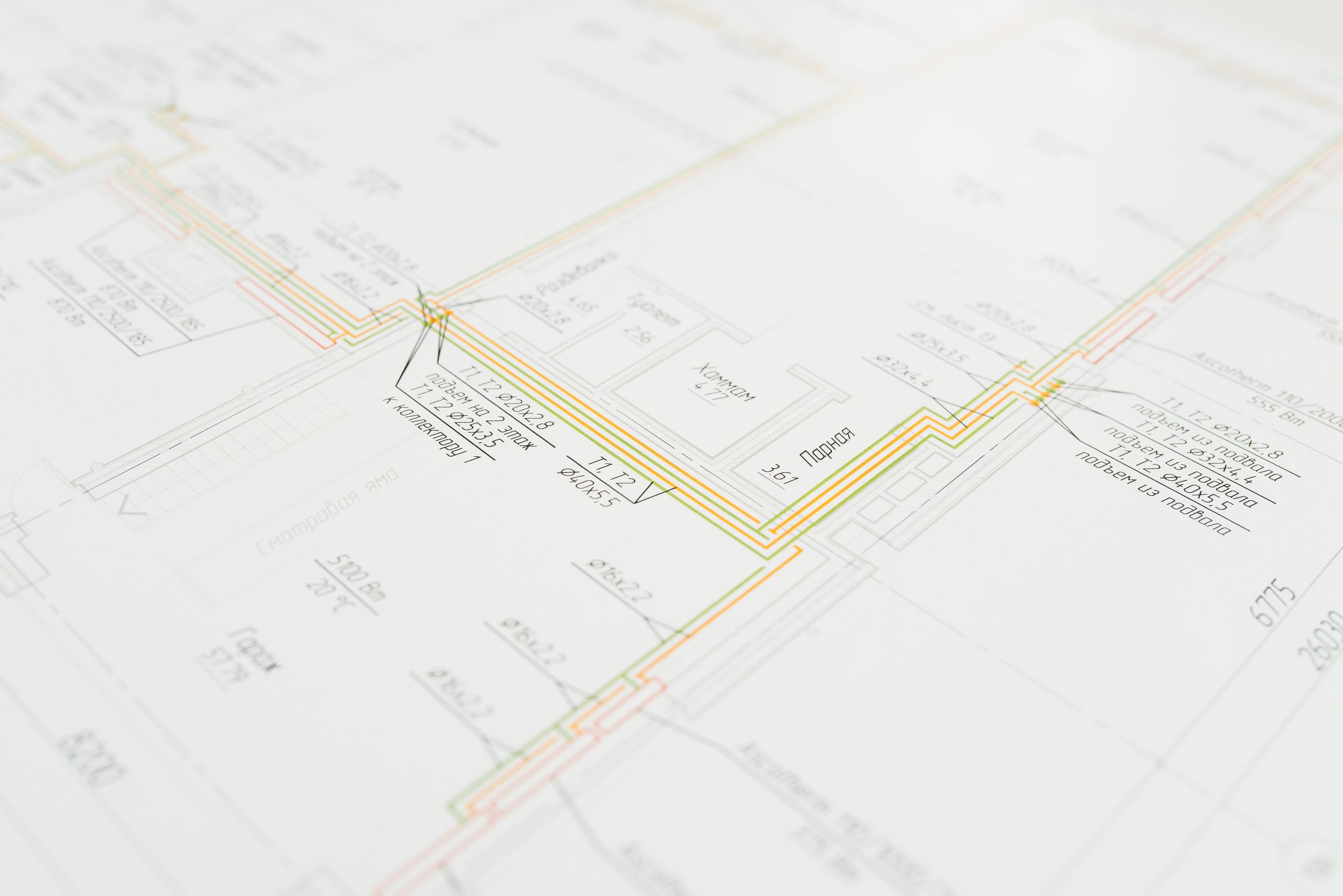 Close-up view of an architectural blueprint, showcasing intricate design details.